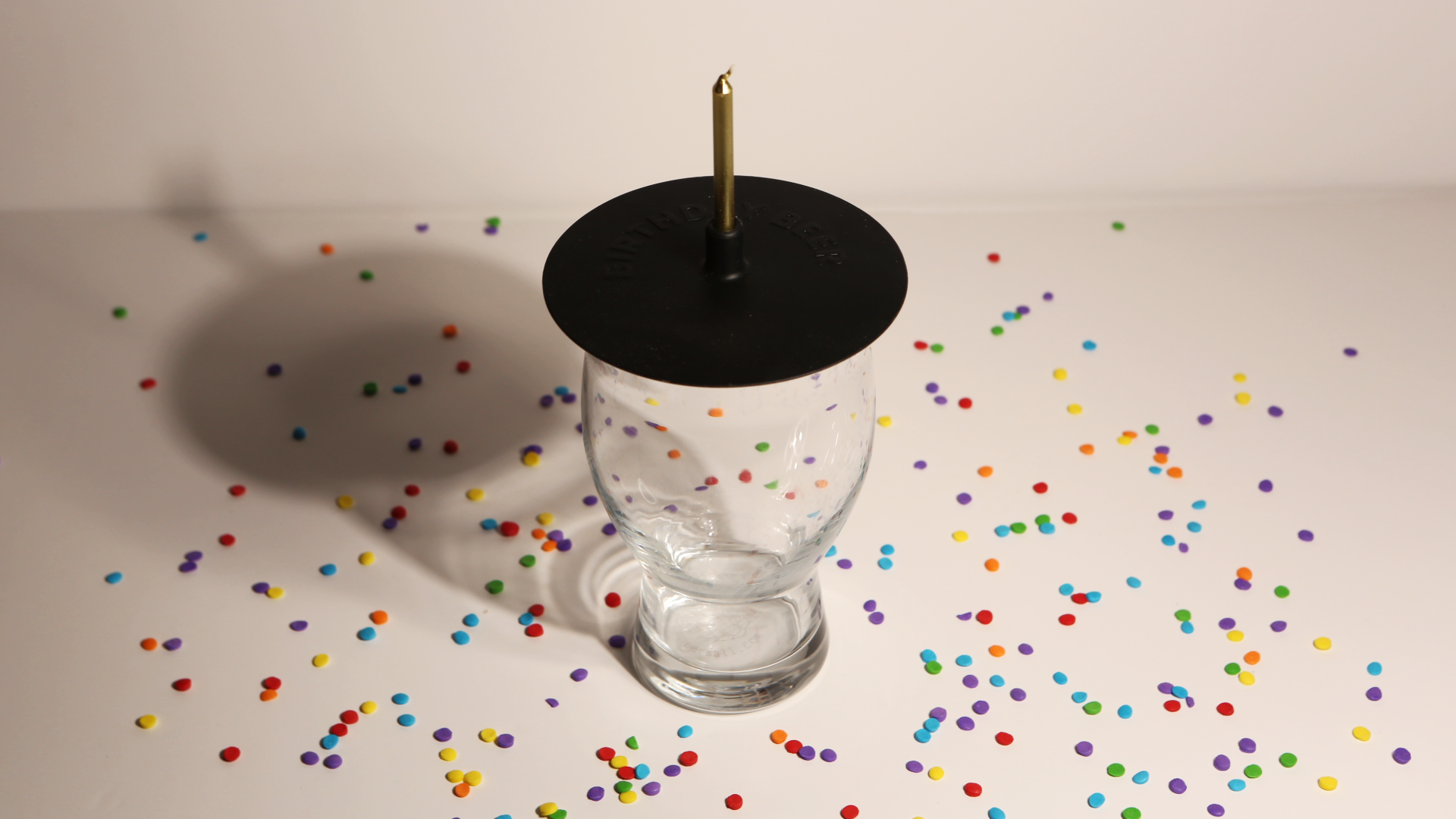 Lit Lids silicone candle holder on a birthday beer glass