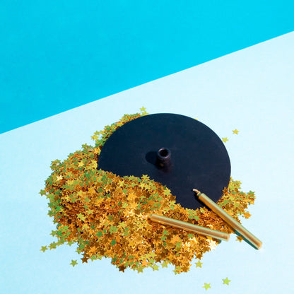 Silicone Drink holder for glassware with gold sprinkles on a blue and white background